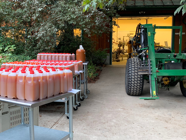 freshly pressed apple juice awaiting pickup at Laughing Apple Farm on Salt Spring Island